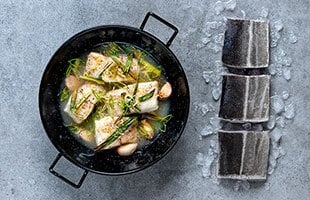 Oven-baked saithe in lemon and apple sauce